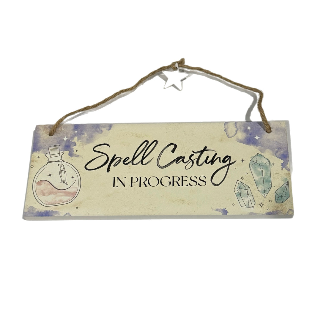 Spell casting in progress hanging sign