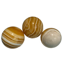 Load image into Gallery viewer, Orange Banded Calcite Sphere
